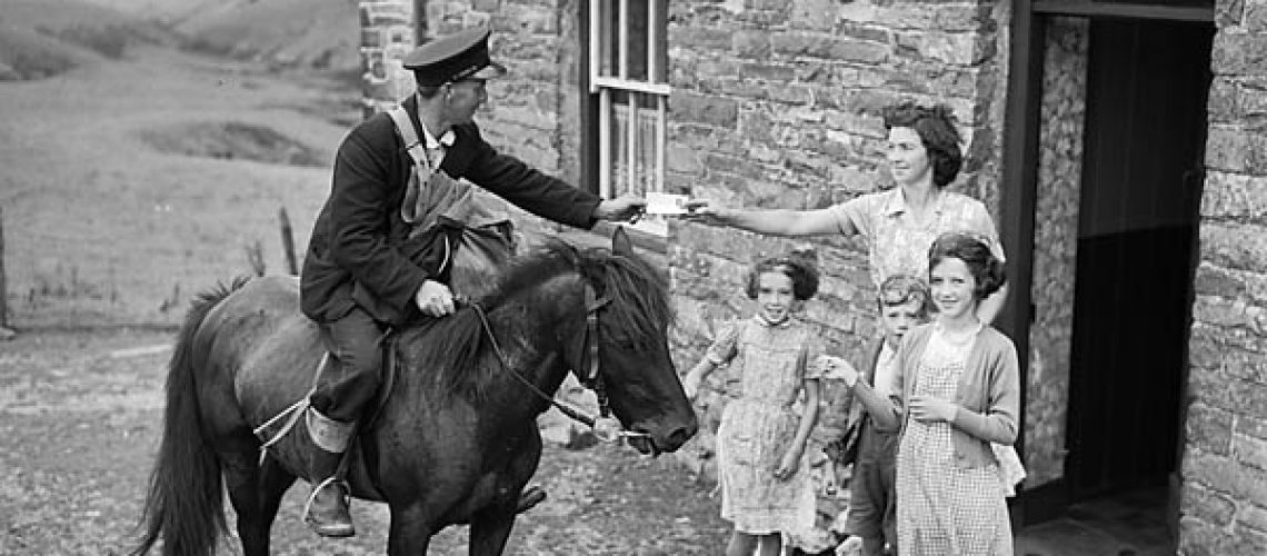 Delivering post in 1955 - Copyright Geoff Charles - National Library of Wales